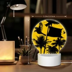 Round Acrylic Night Light, A Black And White Image Of A Bird Flying In Front Of A Yellow Flag. -Acrylic Night Light Shop 019e65cee9bcc963a483bf5f26a4e2d5f62f14b9