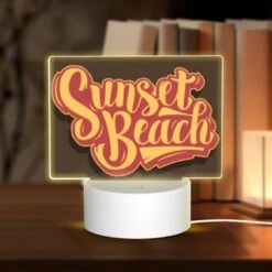 Rectangular Acrylic Night Light, A Sunset Beach Sign With Yellow Letters.