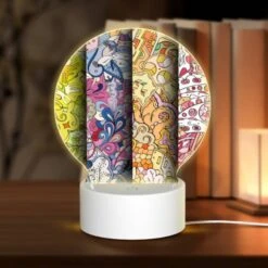 Round Acrylic Night Light, Three Colorful Designs Are Displayed On A Wall.