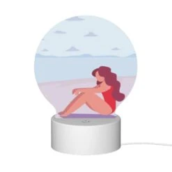 Round Acrylic Night Light, A Woman In A Red Bathing Suit Is Sitting On The Beach. -Acrylic Night Light Shop 11c70801899ee271c80aceb2f89b7e13c1d939dd