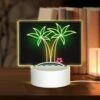 Rectangular Acrylic Night Light, A Neon Sign Of Palm Trees And A Star.