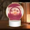 Round Acrylic Night Light, A Poster Of A Beach Resort With A Sunset In The Background.
