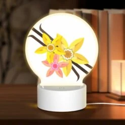 Round Acrylic Night Light, A Yellow Flower With A Pink Center Is Surrounded By Other Yellow Flowers.