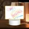 Rectangular Acrylic Night Light, A Colorful Flower With A Green Stem And A Blue Arrow.