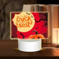 Rectangular Acrylic Night Light, A Halloween Themed Poster With A Pumpkin And A Spider Web.