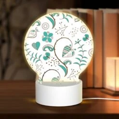 Round Acrylic Night Light, A Pattern Of Hearts And Flowers With A Blue Background.