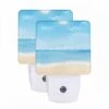 Night Light Set Of 2, A Beautiful Beach Scene With A Blue Sky