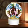 Round Acrylic Night Light, A Colorful Advertisement Featuring A Woman In A Bikini.