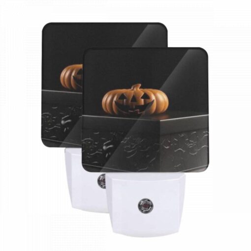 Night Light Set Of 2, A Carved Pumpkin Is Sitting On A Black Box. -Acrylic Night Light Shop 36f2b1889f3bb0e01963a1141d66f1947296f9a5