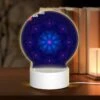 Round Acrylic Night Light, A Blue And Pink Geometric Flower.
