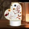 Love Acrylic Night Light, A Collection Of Flowers And Leaves On A White Background.