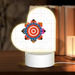 Love Acrylic Night Light, A Group Of People Are Standing Around A Circle With A Bullseye In The Middle.