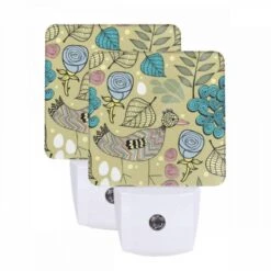 Night Light Set Of 2, A Colorful Bird With A Yellow Beak Stands In Front Of A Leafy Plant.