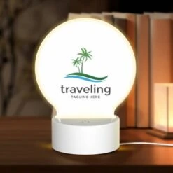 Round Acrylic Night Light, A Logo For Traveling With A Palm Tree In The Background.