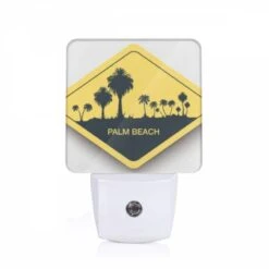 Night Light, A Yellow Sign With The Words "Palm Beach" Written On It.