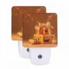 Night Light Set Of 2, A Box Of Pumpkins With A Bow On Top.