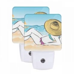 Night Light Set Of 2, A Woman Is Laying On The Beach