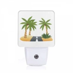 Night Light, A Road Is Shown Between Two Palm Trees.