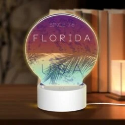 Round Acrylic Night Light, A Blue And Purple Circle With The Words "Florida USA" Written In White.