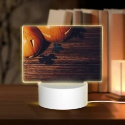Rectangular Acrylic Night Light, A Wooden Table With A Pumpkin On It.