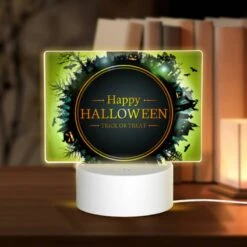 Rectangular Acrylic Night Light, A Round Sign With A Halloween Theme.