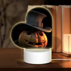 Love Acrylic Night Light, A Carved Pumpkin With A Top Hat On It.