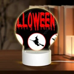 Round Acrylic Night Light, A Halloween Sign With Four Different Images Of Witches And Bats.