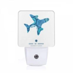 Night Light, A Blue And White Airplane With A Snowflake Pattern On The Tail.