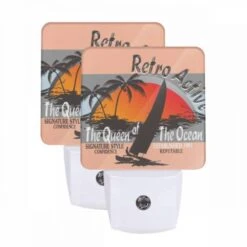 Night Light Set Of 2, A Boat With A Person In It Is On The Ocean.