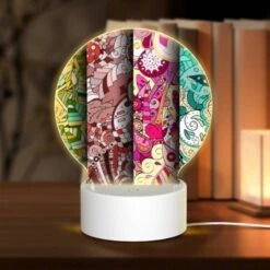 Round Acrylic Night Light, Four Different Colored Paintings Of Flowers.