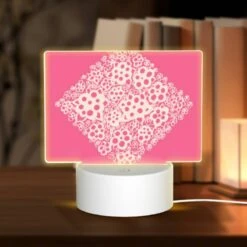 Rectangular Acrylic Night Light, A Pink Square With White Flowers On It.