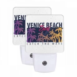 Night Light Set Of 2, A Surfboard With A Picture Of A Beach And The Words "Catch The Wave" On It.