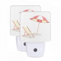 Night Light Set Of 2, A Colorful Umbrella Is Open And Placed Over A Striped Lounge Chair.