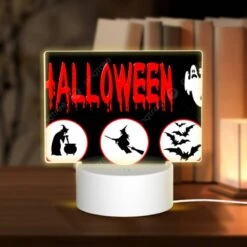 Rectangular Acrylic Night Light, A Halloween Sign With Four Different Images Of Witches And Bats.