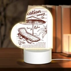Love Acrylic Night Light, A Beach Umbrella Is Open And Shading A Lounge Chair.