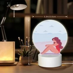 Round Acrylic Night Light, A Woman In A Red Bathing Suit Is Sitting On The Beach. -Acrylic Night Light Shop c6c913f4555fc3bb1c1ec54843de71a79c59174f