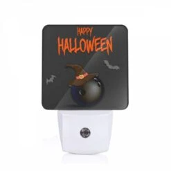 Night Light, A Black And White Image Of A Bomb With A Witch's Hat On It.