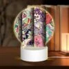 Round Acrylic Night Light, Three Colorful Designs Are Displayed On A Single Sheet Of Paper.