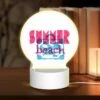 Round Acrylic Night Light, A Pink And Blue Sign That Says "Summer Beach.".