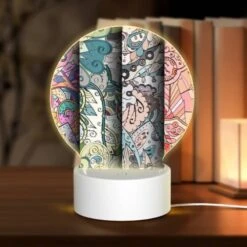 Round Acrylic Night Light, Four Different Colored Designs Of Swirls And Patterns.