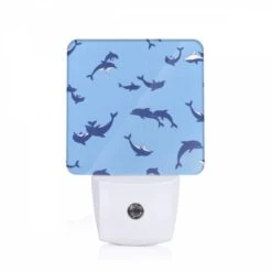 Night Light, A Blue And White Pattern Of Whales Swimming In The Ocean.