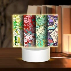 Rectangular Acrylic Night Light, Four Different Colored Papers With Designs On Them.