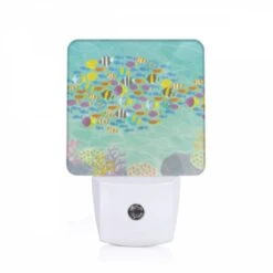 Night Light, A Colorful Fish Swims In A Sea Of Other Fish.