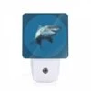 Night Light, A Shark Is Shown In A Blue Ocean.